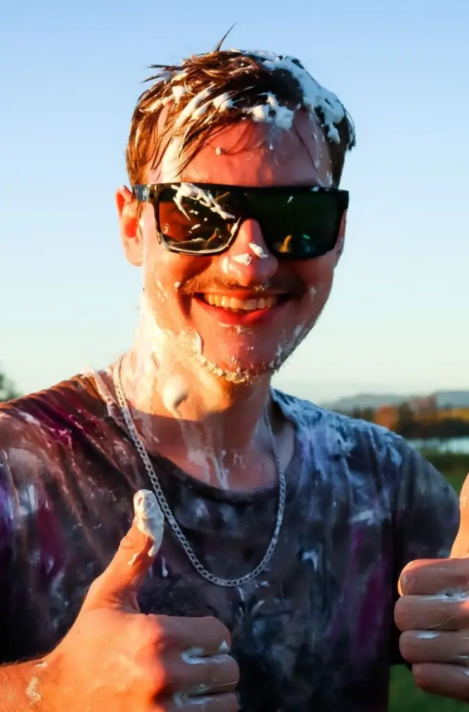 A Word of Life team member laughing after a messy game